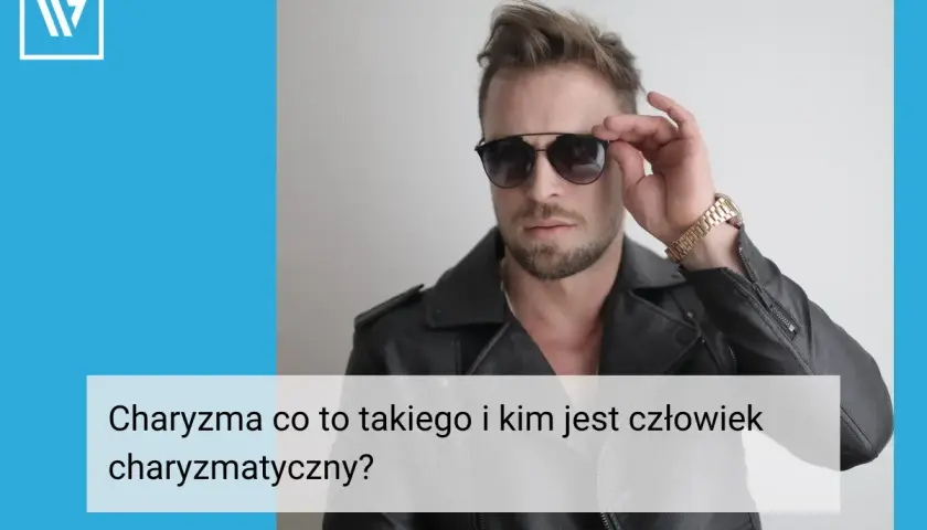 Charyzmatyczny mężczyzna w okularach przeciwsłonecznych i skórzanej kurtce.