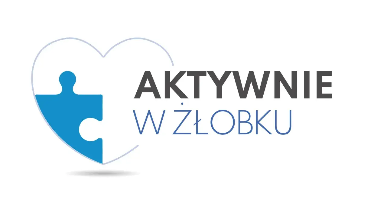 Niebieski element puzzla w kształcie serca z napisem "AKTYWNIE W ŻŁOBKU".